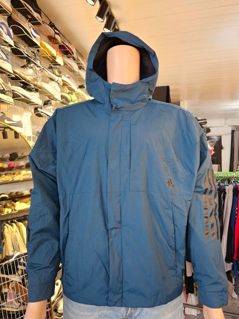 Adidas hooded windbreaker Jacket (Category: Coats, Jackets and Outerwear) located in Baguio. Submitted by kayeonlineshop (Listing ID 1460770401, Image 2). Description: -blue Adidas hooded windbreaker featuring dark three-stripe branding on the sleeve. -measurements included in the photos..