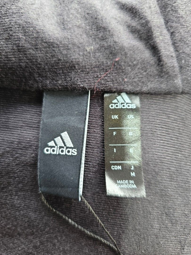Adidas hooded windbreaker Jacket (Category: Coats, Jackets and Outerwear) located in Baguio. Submitted by kayeonlineshop (Listing ID 1460770401, Image 3). Description: -blue Adidas hooded windbreaker featuring dark three-stripe branding on the sleeve. -measurements included in the photos..