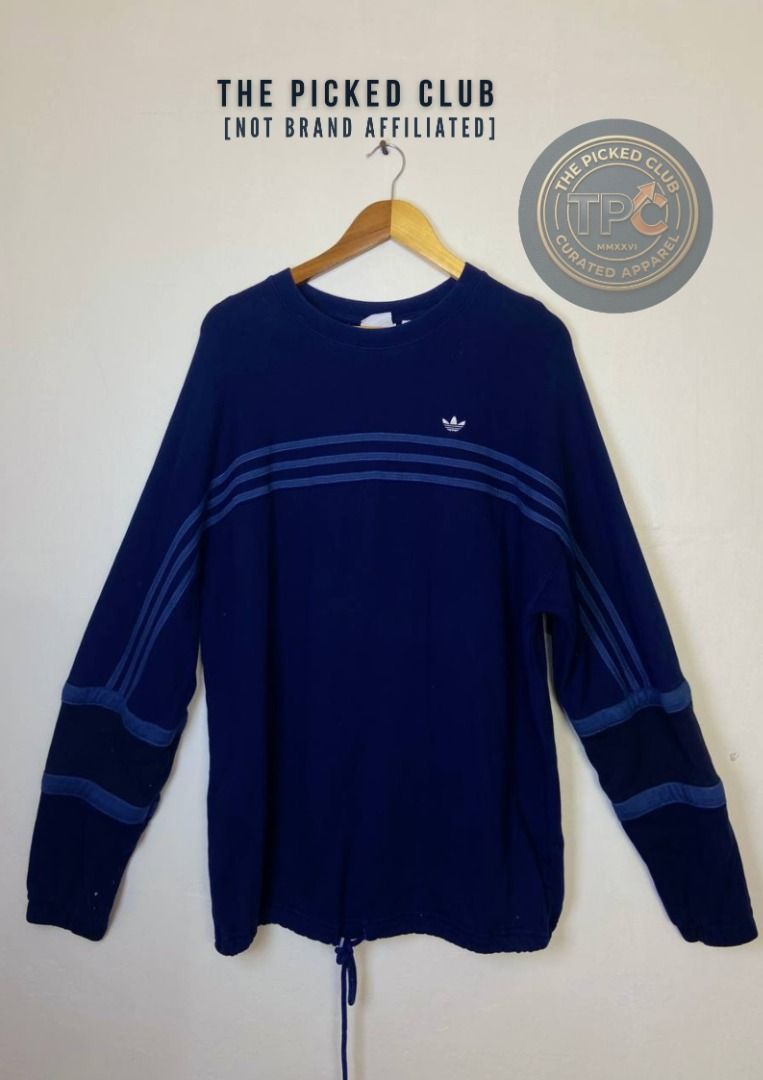 Adidas Long Sleeve Sweatshirt Navy Blue (Category: Coats, Jackets and Outerwear) located in Imus. Submitted by thepickedclub (Listing ID 1460763236, Image 1). Description: large (26x29) - Navy blue Adidas sweatshirt - Iconic three stripes on sleeves and chest - Drawstring hem for adjustable fit - Soft and comfortable material - Perfect for casual wear or layering.