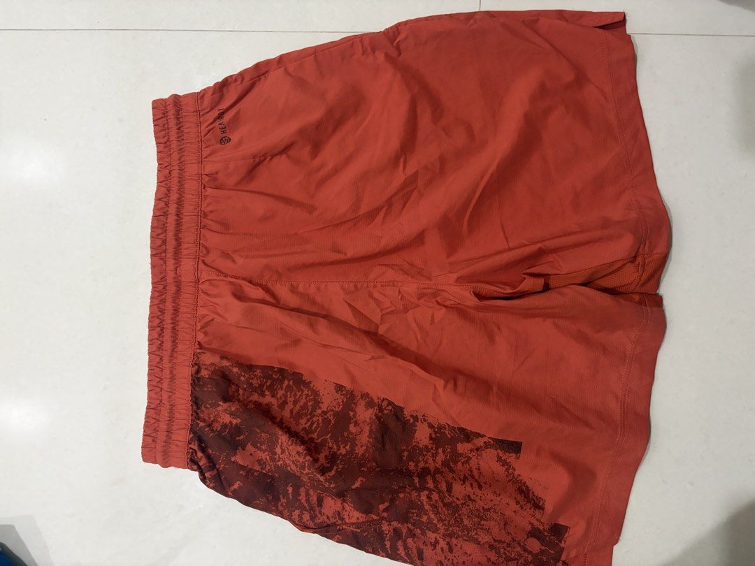 Adidas Running Shorts Orange (Category: Activewear) located in Marilao. Submitted by astroman.22 (Listing ID 1460887951, Image 2). Description: - Orange Adidas running shorts - Graphic print on upper back - Elastic waistband with drawstring - Mesh paneling on sides for breathability - Adidas logo on lower right leg - Ideal for workouts and casual wear.