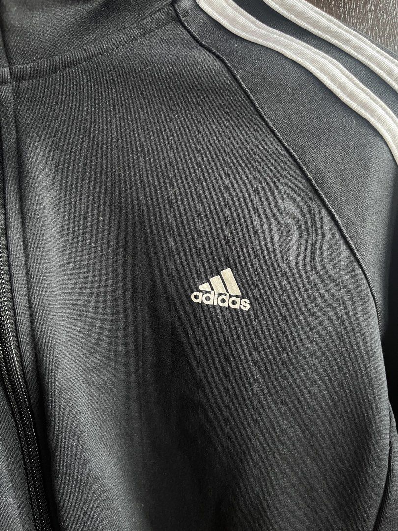 Adidas Slim Fit 3 Stripes Black Jacket (Category: Coats, Jackets and Outerwear) located in Quezon City. Submitted by shhmm (Listing ID 1460749706, Image 2). Description: adidas black jacket, zip-up, with pockets has some lint lang from laundry logos are still good, no cracks .