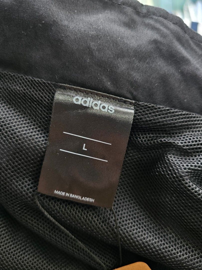 Adidas full zip track jacket (Category: Coats, Jackets and Outerwear) located in Baguio. Submitted by kayeonlineshop (Listing ID 1460801648, Image 3). Description: -black Adidas track jacket featuring a stand-up collar and a white brand logo on the chest -measurements included in the photos.
