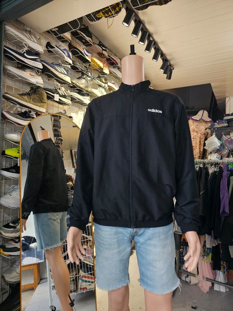 Adidas full zip track jacket (Category: Coats, Jackets and Outerwear) located in Baguio. Submitted by kayeonlineshop (Listing ID 1460801648, Image 1). Description: -black Adidas track jacket featuring a stand-up collar and a white brand logo on the chest -measurements included in the photos.