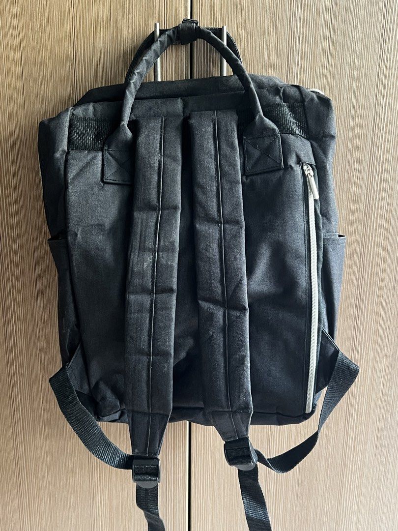 Adventure Supply Co. Black Backpack / 13" Laptop Bag with Multiple Compartments (Category: Backpacks) located in Manila. Submitted by honey.001 (Listing ID 1460745675, Image 2). Description: * Brand: Adventure Supply Company * Color: Classic Matte Black * Design: Anello-style square backpack silhouette with dual top handles and a snap-button closure strip * Capacity: Spacious main compartment that easily fits a 13-inch laptop, tablets, notebooks,