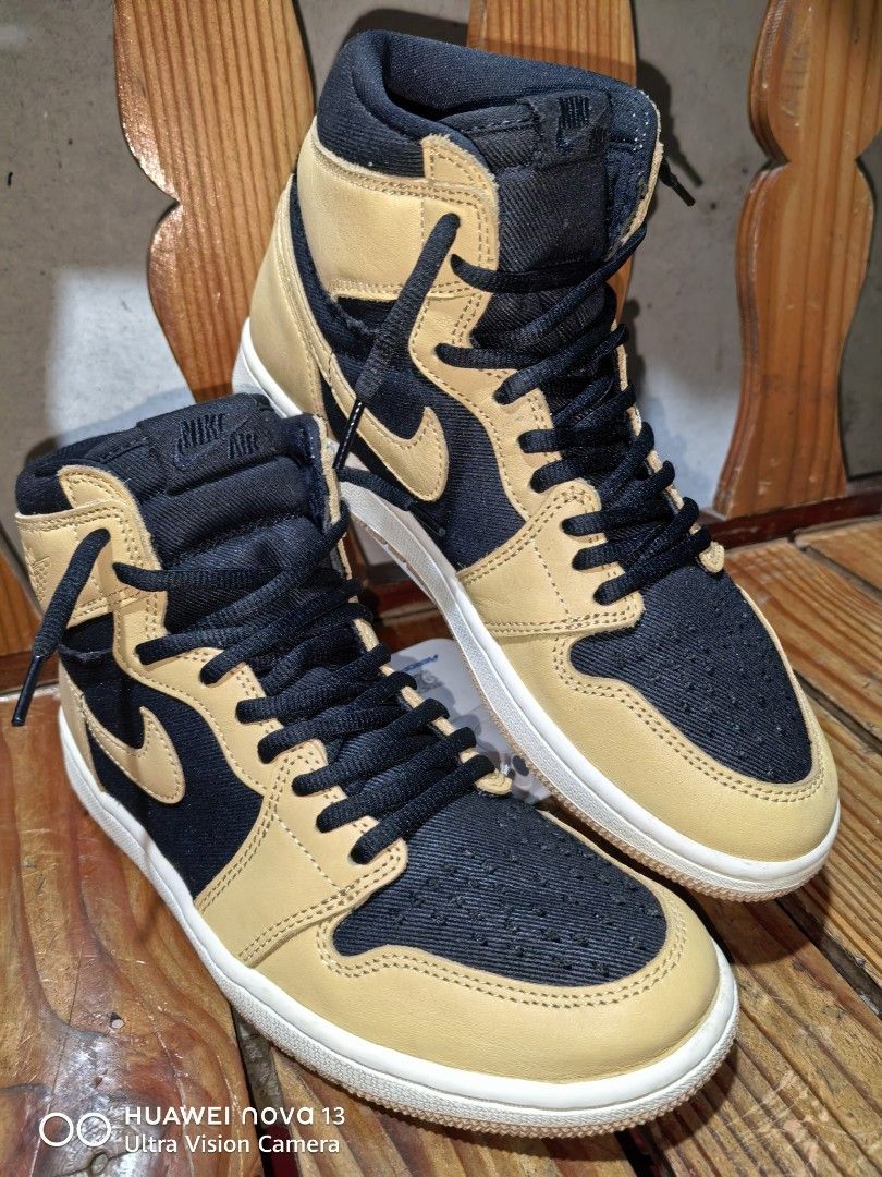Air Jordan 1 High OG "Light British Tan" (Category: Sneakers) located in Cebu City. Submitted by abellarces30419 (Listing ID 1460752521, Image 1). Description: - Authentic Air Jordan 1 retro high OG - Colorway: Vachetta tan leather black denim twill Original /Ukay2x source - Materials: Tan leather and black denim-like fabric - Design: Classic high-top silhouette - Iconic details: Air Jordan wings logo - Condition: Soles show some wear, but plenty