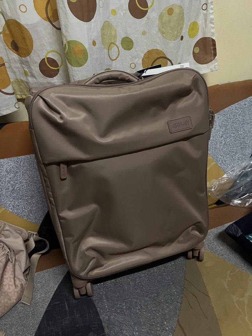 AIRWAY Luggage Bag lightweight (Category: Luggage) located in Quezon City. Submitted by summerraine15 (Listing ID 1460431297, Image 1). Description: - AIRWAY luggage bag in a neutral taupe color. - Convenient top handle and wheels for easy mobility. - Front zippered compartment for quick access to essentials. - Ideal carry-on size for short trips or weekend travel. - used once, traveled Cebu Pacific and PAL both small plane and it was allowed siz