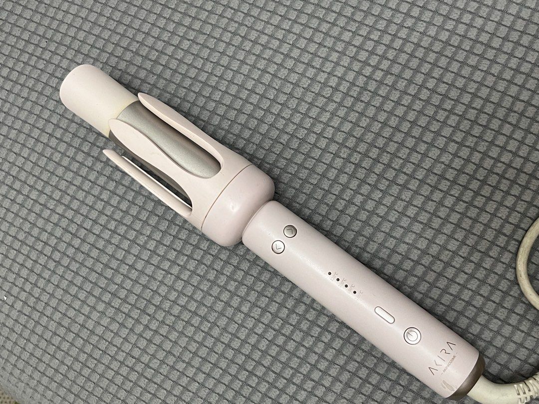AKIRA Automatic Rotating Hair Curler Pink (Category: Hair) located in Dasmarinas. Submitted by 365daysofsummer (Listing ID 1460901507, Image 1). Description: - Akira Automatic Hair Curler in Pink - Effortless styling with a rotating barrel - Adjustable temperature settings: 160°C to 220°C - Convenient controls on the handle - Corded for reliable power .