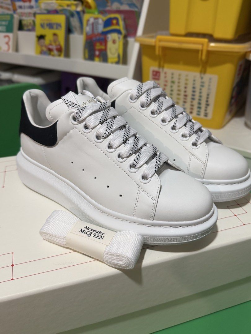Alexander McQueen Oversized Sneakers White Black (Category: Sneakers) located in Marikina City. Submitted by sisbasco999 (Listing ID 1460861560, Image 2). Description: - Authentic Alexander McQueen Oversized Sneakers - Classic white leather with a stylish black heel tab - Comes with original laces and an additional pair of white laces - Features the iconic chunky sole for a modern look.