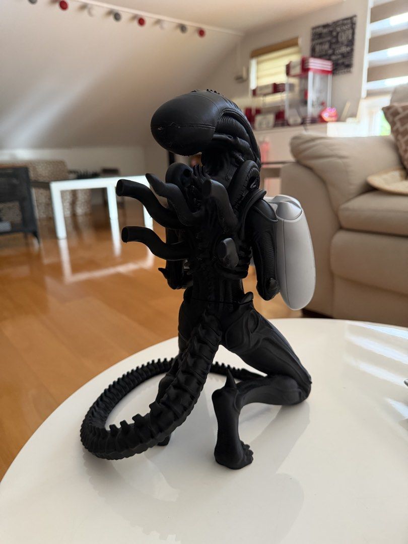 Alien Xenomorph Controller Holder Stand (Category: Controllers) located in Manila. Submitted by heleensym (Listing ID 1460803337, Image 3). Description: - Cool Xenomorph-shaped holder for your Xbox controller. - Safely displays and stores your controller. - Perfect for Alien franchise fans & gamersss - Adds a unique touch to your gaming setup - 3D Printed - Controller not included.