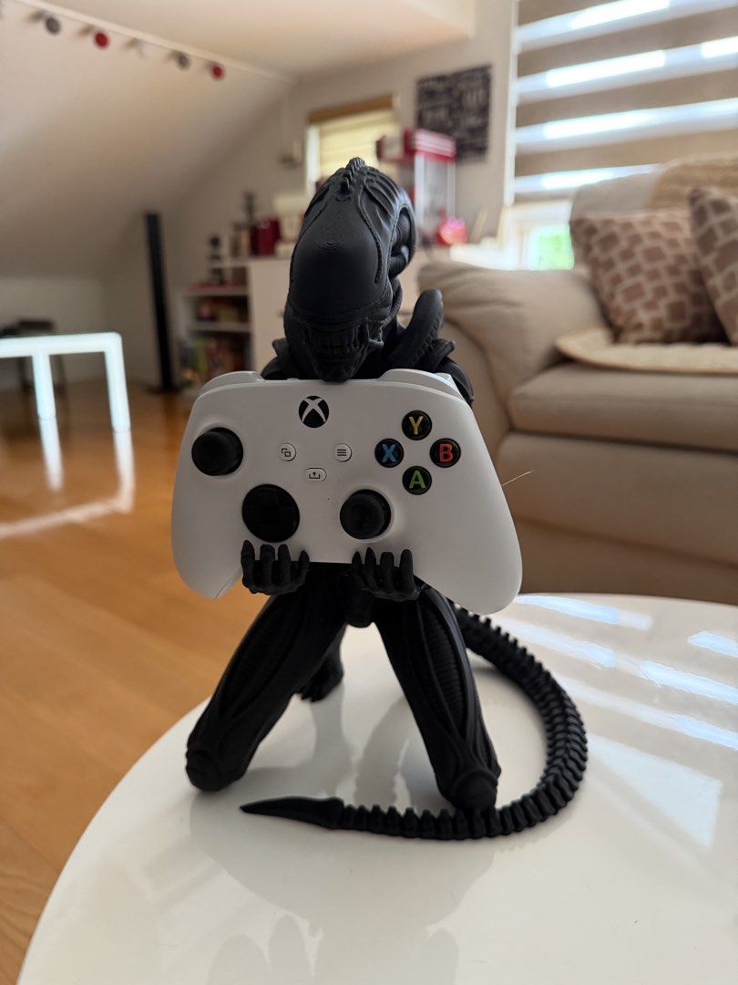 Alien Xenomorph Controller Holder Stand (Category: Controllers) located in Manila. Submitted by heleensym (Listing ID 1460803337, Image 2). Description: - Cool Xenomorph-shaped holder for your Xbox controller. - Safely displays and stores your controller. - Perfect for Alien franchise fans & gamersss - Adds a unique touch to your gaming setup - 3D Printed - Controller not included.