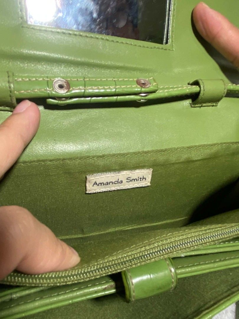 Amanda Smith Green Croc Embossed Wallet with Strap (Category: Wallets & Card holders) located in Baguio. Submitted by leah_rodrigo (Listing ID 1460758616, Image 3). Description: Green wallet with croc embossed texture. Has a detachable strap. Inside, you'll find card slots and a zippered compartment. Also includes a small mirror. Great for organizing your essentials. can be a clutch and cross body bag, no flaws excellent condition. .