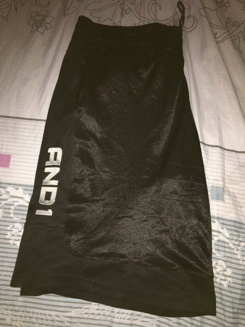 AND1 Black Basketball Shorts (Category: Shorts) located in Tayabas. Submitted by mawiii_haragun (Listing ID 1460830254, Image 1). Description: - Authentic AND1 basketball shorts - Comfortable elastic waistband with adjustable drawstring - Convenient side pockets - Breathable and soft material for all-day comfort - Ideal for basketball games, workouts, or casual wear - Features the iconic AND1 logo.