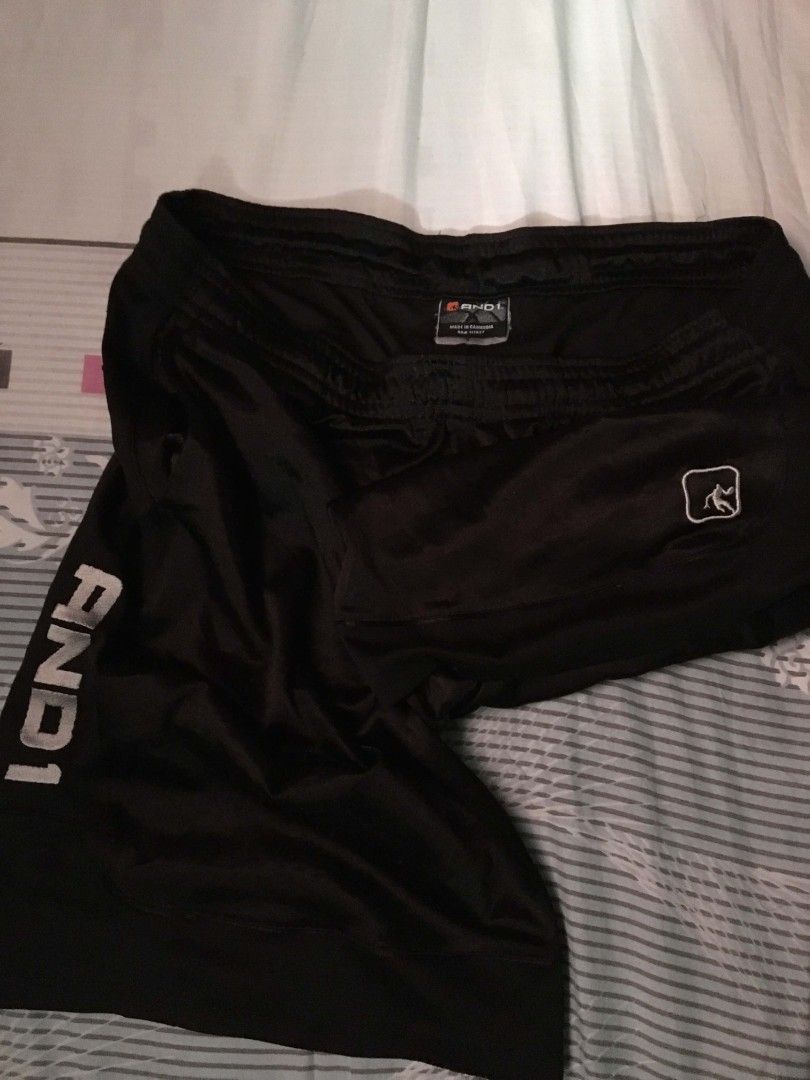 AND1 Black Basketball Shorts (Category: Shorts) located in Tayabas. Submitted by mawiii_haragun (Listing ID 1460830254, Image 2). Description: - Authentic AND1 basketball shorts - Comfortable elastic waistband with adjustable drawstring - Convenient side pockets - Breathable and soft material for all-day comfort - Ideal for basketball games, workouts, or casual wear - Features the iconic AND1 logo.