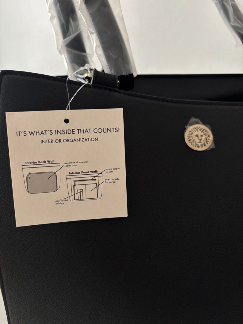 Anne Klein Black Tote Bag with Interior Organization (Category: Tote Bags) located in Manila. Submitted by khloesmom (Listing ID 1460723485, Image 2). Description: - Brand new Anne Klein black tote bag - Comes with a matching pouch - Interior features multiple organization pockets (including zip-around and pen/lipstick holders) - Handles still have original plastic wrapping - Includes original dust bag.
