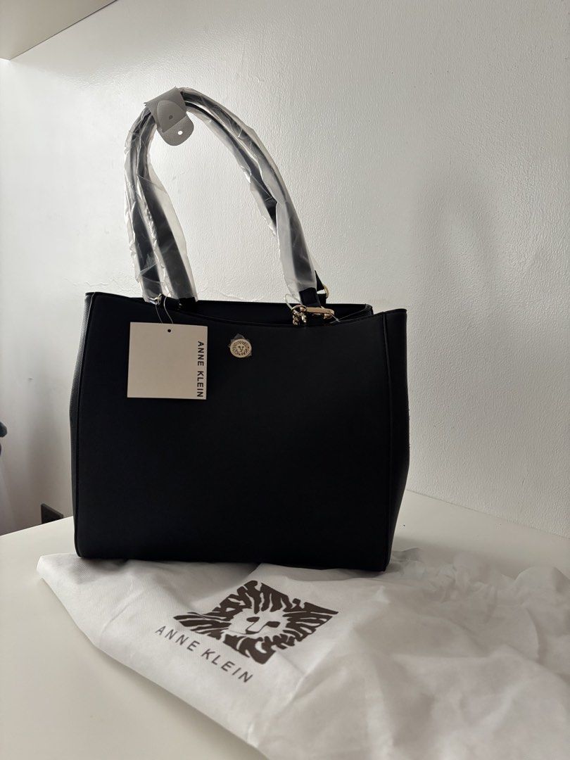Anne Klein Black Tote Bag with Interior Organization (Category: Tote Bags) located in Manila. Submitted by khloesmom (Listing ID 1460723485, Image 1). Description: - Brand new Anne Klein black tote bag - Comes with a matching pouch - Interior features multiple organization pockets (including zip-around and pen/lipstick holders) - Handles still have original plastic wrapping - Includes original dust bag.