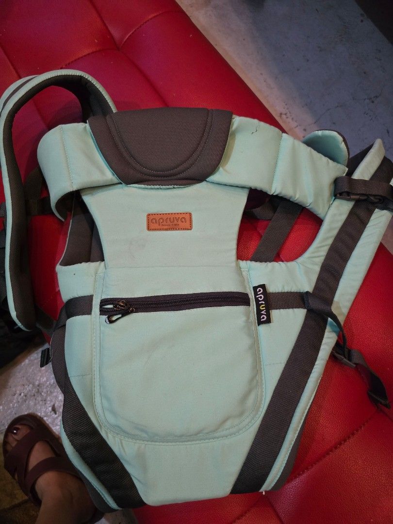 Apruva Baby Carrier Mint Green (Category: Carriers & Slings) located in Manila. Submitted by yayialrt (Listing ID 1460727144, Image 1). Description: - Apruva baby carrier in a lovely mint green color. - Features adjustable straps for a customized, comfortable fit. - Includes a convenient zippered pocket on the front for essentials. - Allows for hands-free carrying, making outings easier. - Designed for quick and simple on and off..