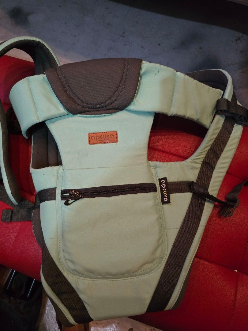 Apruva Baby Carrier Mint Green (Category: Carriers & Slings) located in Manila. Submitted by yayialrt (Listing ID 1460727144, Image 2). Description: - Apruva baby carrier in a lovely mint green color. - Features adjustable straps for a customized, comfortable fit. - Includes a convenient zippered pocket on the front for essentials. - Allows for hands-free carrying, making outings easier. - Designed for quick and simple on and off..