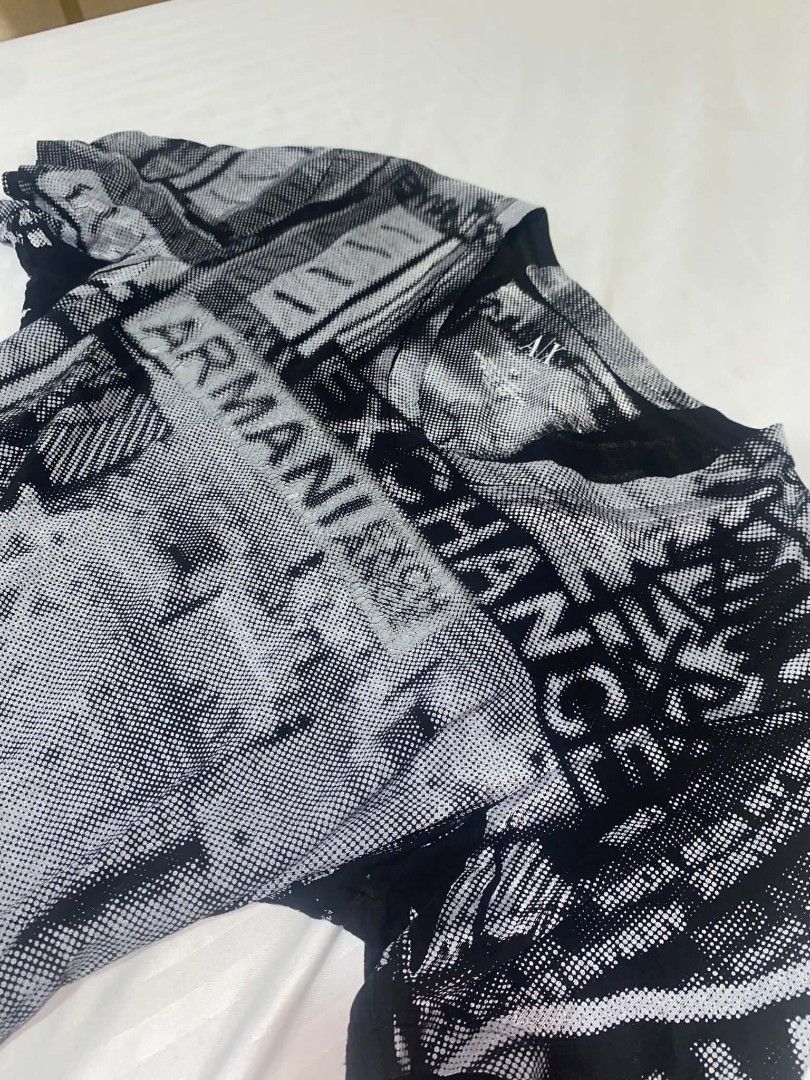 Armani Exchange Black & White V-neck shirt (Category: Shirts) located in Cabuyao City. Submitted by lamperouge11 (Listing ID 1460646310, Image 2). Description: A piece of black & white v-neck shirt from Armani Exchange. Features: - A v neck collar. - Repeating "Armani Exchange" line from the front and back. - Random sign & shapes in color black and white. Flaws: Distressed print. Condition: Great Size: Xs on tag Dimensions: L27×W16.5.