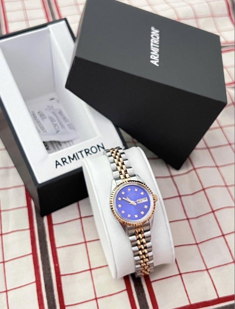 Armitron Two-Tone Blue Dial Day-Date Watch (Category: Women's Watches) located in Manila. Submitted by allysamaligaya28 (Listing ID 1460756602, Image 2). Description: - Armitron Watch - Stunning Blue Dial - Elegant Diamond Markers - Two-Tone Silver and Gold Band - Convenient Day and Date Display - Comes with Original Box , warranty/manual, and Silica Gel Packet - Versatile: Ideal for Everyday or Special Occasions.
