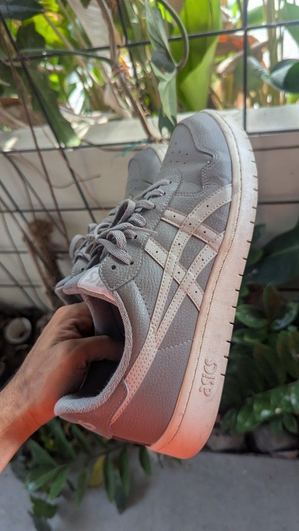 Asics Grey Leather Sneakers (Category: Sneakers) located in Mati. Submitted by kepsky00 (Listing ID 1460781309, Image 1). Description: - Grey Asics sneakers - Leather upper with white accents - Features Ortholite insole for comfort - Soles show some wear, but plenty of life remaining - Ideal for casual wear or light activity - Sold as is.