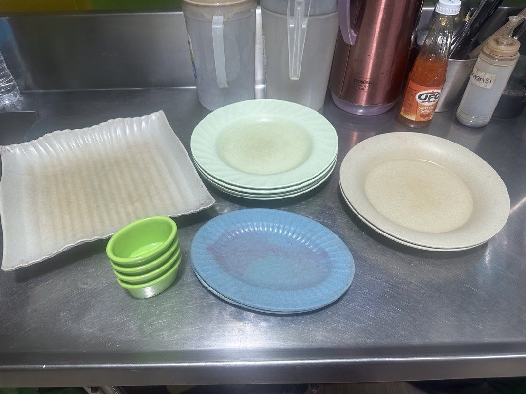 Assorted Plates and Small Green Bowls (Category: Dinnerware & Cutlery) located in Manila. Submitted by zuripot0726 (Listing ID 1460911947, Image 1). Description: - Set includes: rectangular white plate, stack of light green plates, stack of blue plates, and stack of small green bowls. - Versatile: Perfect for serving dishes or as individual meal plates/bowls. - Condition: Shows some signs of use, but fully functional and ready for your kitchen. �