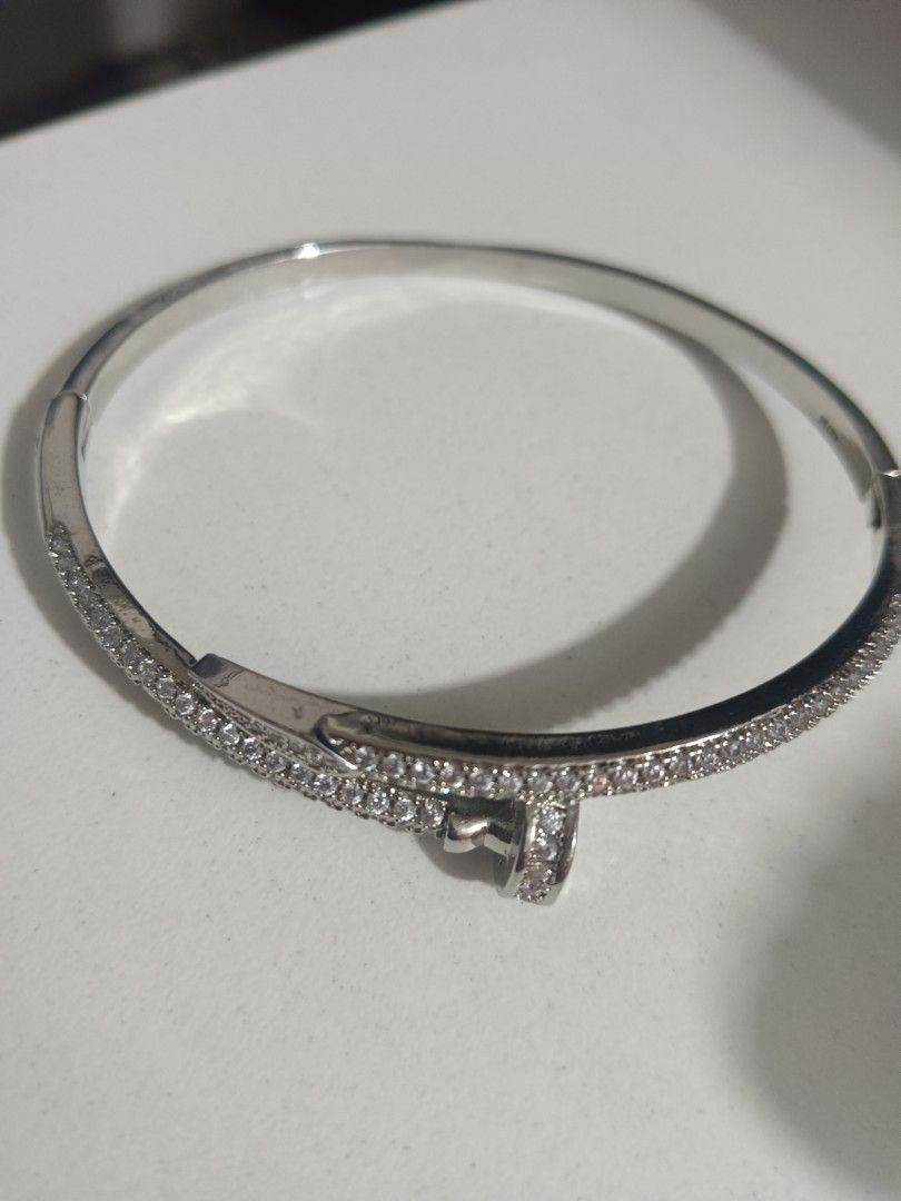 AU750 Diamond Nail Bangle Bracelet (Category: Bracelets) located in Manila. Submitted by clover_co. (Listing ID 1460887676, Image 3). Description: - Sparkling stones bangle bracelet - Unique nail design - Secure clasp closure - Crafted from 18k gold (AU750 marked) - Makes a stunning statement piece .
