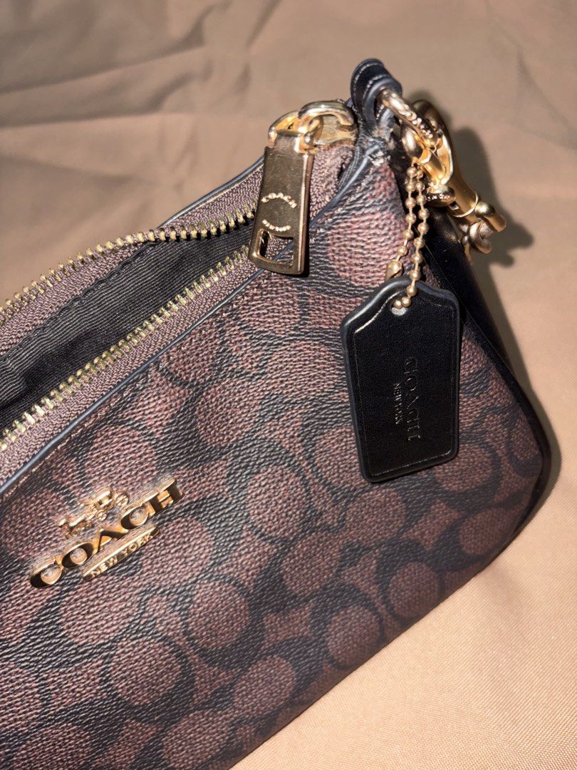 Authentic Coach C2479-CV933 Teri Shoulder Bag (Category: Shoulder Bags) located in Manila. Submitted by mikrokosmos.__ (Listing ID 1460815419, Image 2). Description: Authentic Coach C2479-CV933 Teri Shoulder Bag Classic Coach Teri Shoulder Bag in brown Signature Canvas. Timeless, elegant, and easy to style—perfect for everyday use or special occasions. Details: * Brand: Coach * Model: C2479-CV933 * Color: Brown / Signature Canvas * Style: Teri Sh
