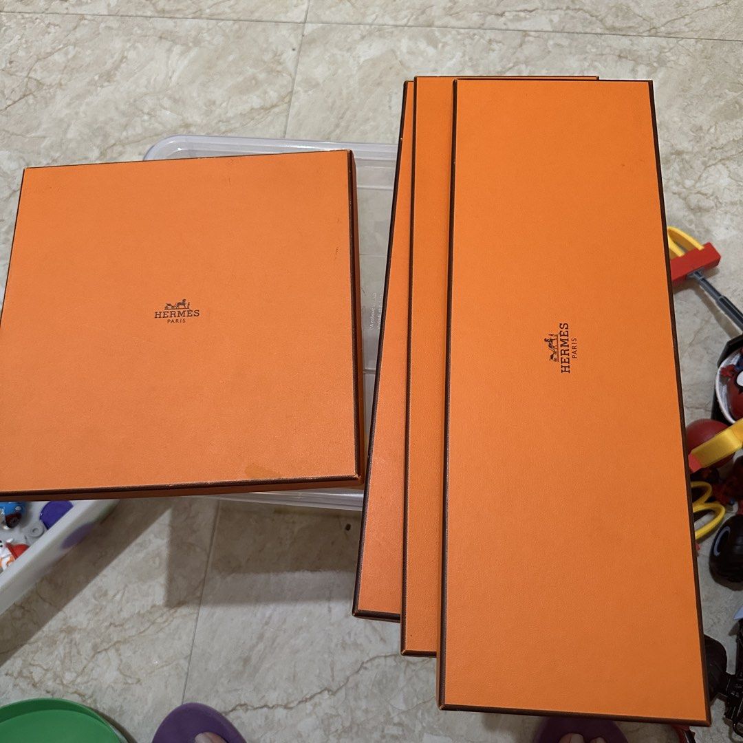 Hermes Orange Gift Boxes (Category: Storage Boxes & Baskets) located in Kawit. Submitted by wevibevintage (Listing ID 1460761853, Image 1). Description: - not sure of auth. Hermes orange boxes - Set includes 1 square box and 3 rectangular boxes - Ideal for gifting or storing small items - Features the classic Hermes logo on all boxes - Boxes are clean and ready for a new home.