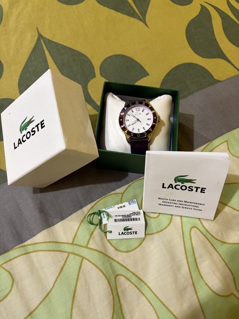 AUTHENTIC LACOSTE WATCH (Category: Women's Watches) located in Manila. Submitted by elizabeth-declutter (Listing ID 1460892186, Image 2). Description: Authentic Lacoste Watch (Complete Set) Brand / Item: Authentic Lacoste Watch (Gold Bezel, Dark Purple Strap) Condition: Brand New / Unused Inclusions: Complete with original box, watch pillow, manual/warranty guide, and price tag. Original Retail Price: $195.00 Selling Price: ₱ 9,999 Details: Comes