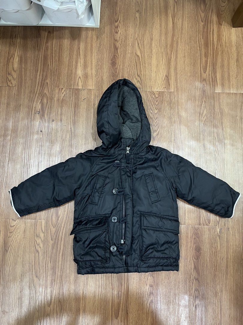 Baby Gap Black Hooded Winter Jacket (Category: Babies & Kids Fashion) located in Paranaque City. Submitted by mycloset1o1 (Listing ID 1460758641, Image 1). Description: - Black hooded jacket from Baby Gap - Soft grey fleece lining for extra warmth - Zipper and button front closure - Two functional front pockets - Ribbed cuffs for a snug fit - Ideal for keeping kids warm in cooler weather.