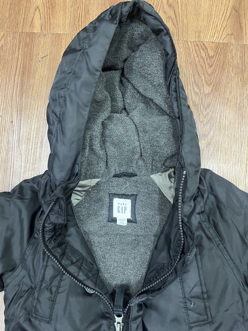 Baby Gap Black Hooded Winter Jacket (Category: Babies & Kids Fashion) located in Paranaque City. Submitted by mycloset1o1 (Listing ID 1460758641, Image 3). Description: - Black hooded jacket from Baby Gap - Soft grey fleece lining for extra warmth - Zipper and button front closure - Two functional front pockets - Ribbed cuffs for a snug fit - Ideal for keeping kids warm in cooler weather.