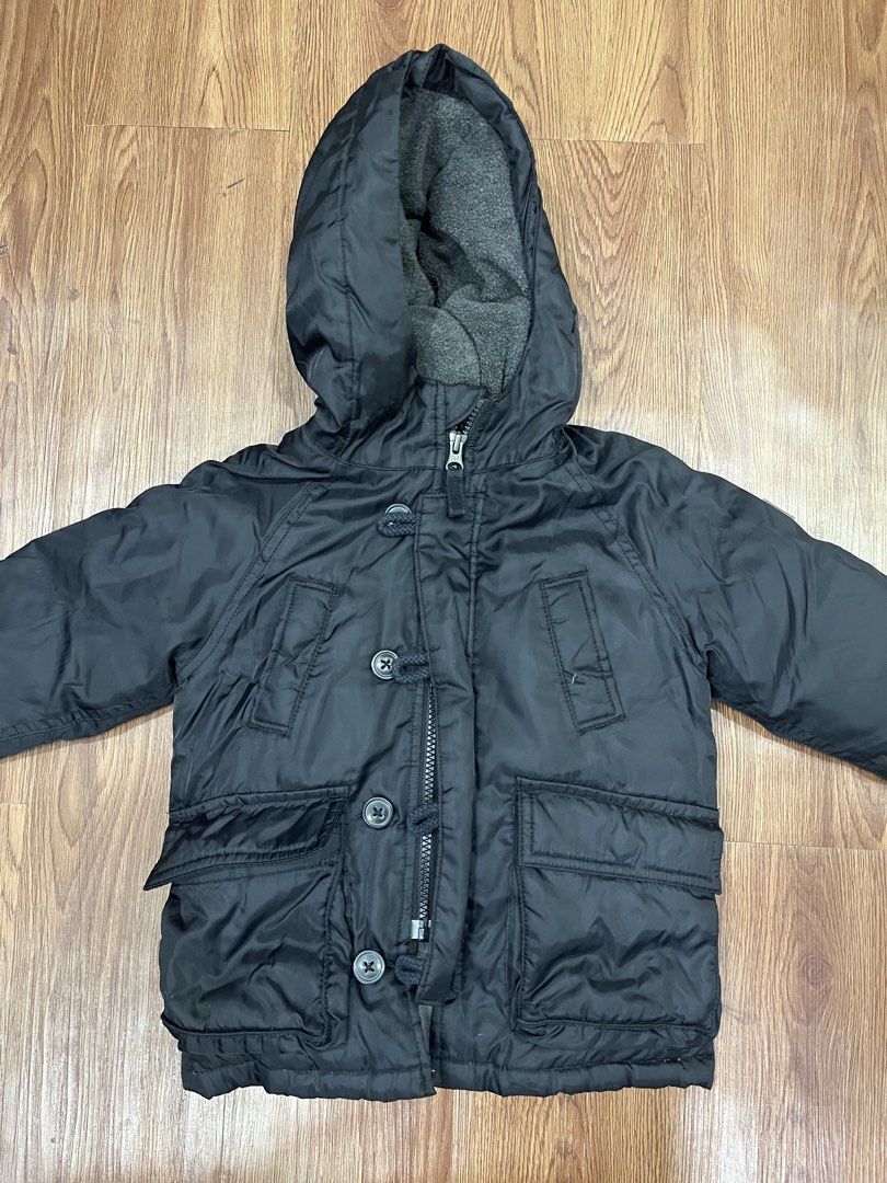 Baby Gap Black Hooded Winter Jacket (Category: Babies & Kids Fashion) located in Paranaque City. Submitted by mycloset1o1 (Listing ID 1460758641, Image 2). Description: - Black hooded jacket from Baby Gap - Soft grey fleece lining for extra warmth - Zipper and button front closure - Two functional front pockets - Ribbed cuffs for a snug fit - Ideal for keeping kids warm in cooler weather.