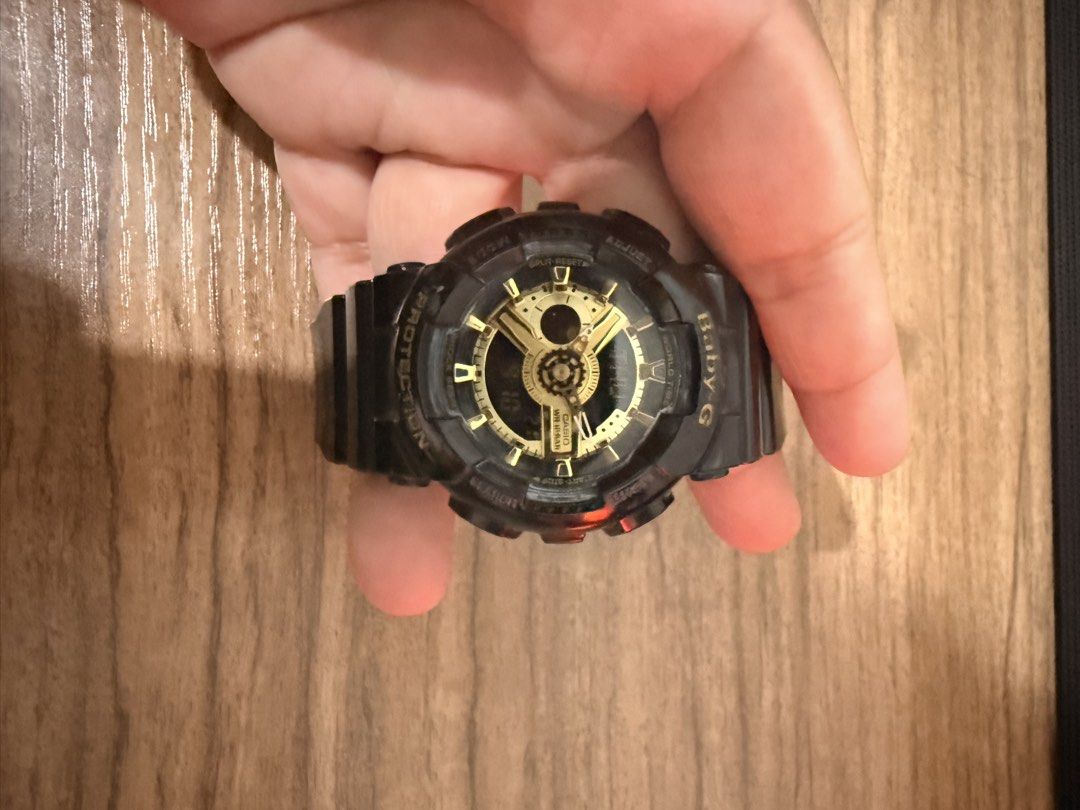 Baby-G Shock Resistant Watch (Category: Women's Watches) located in Manila. Submitted by kaerebear (Listing ID 1460727695, Image 1). Description: - Sleek black Baby-G watch with elegant gold accents. - Built tough: Shock resistant and water resistant up to 100 meters. - Versatile display: Features both digital and analog timekeeping. - Ideal for any occasion: Great for everyday wear or active sports. - Comfortable fit: Adjustable band for a perfe