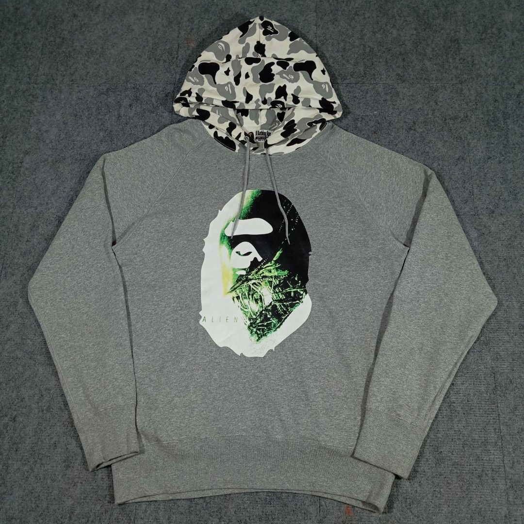 BAPE Alienposter Ape Head Pullover Hoodie (Category: Coats, Jackets and Outerwear) located in Taguig. Submitted by sito. (Listing ID 1460826552, Image 1). Description: For sale! 📣 BAPE Alienposter Ape Head Pullover Hoodie Specs and measurements: • Size Large • Length 30 inches • Width 23 inches Condition Details: • Issue: NONE • Color rate: 10/10 • Overall Condition: 10/10 Market Value Reference: ₱18,509 Asking Price: ~₱9,999 Transaction Details