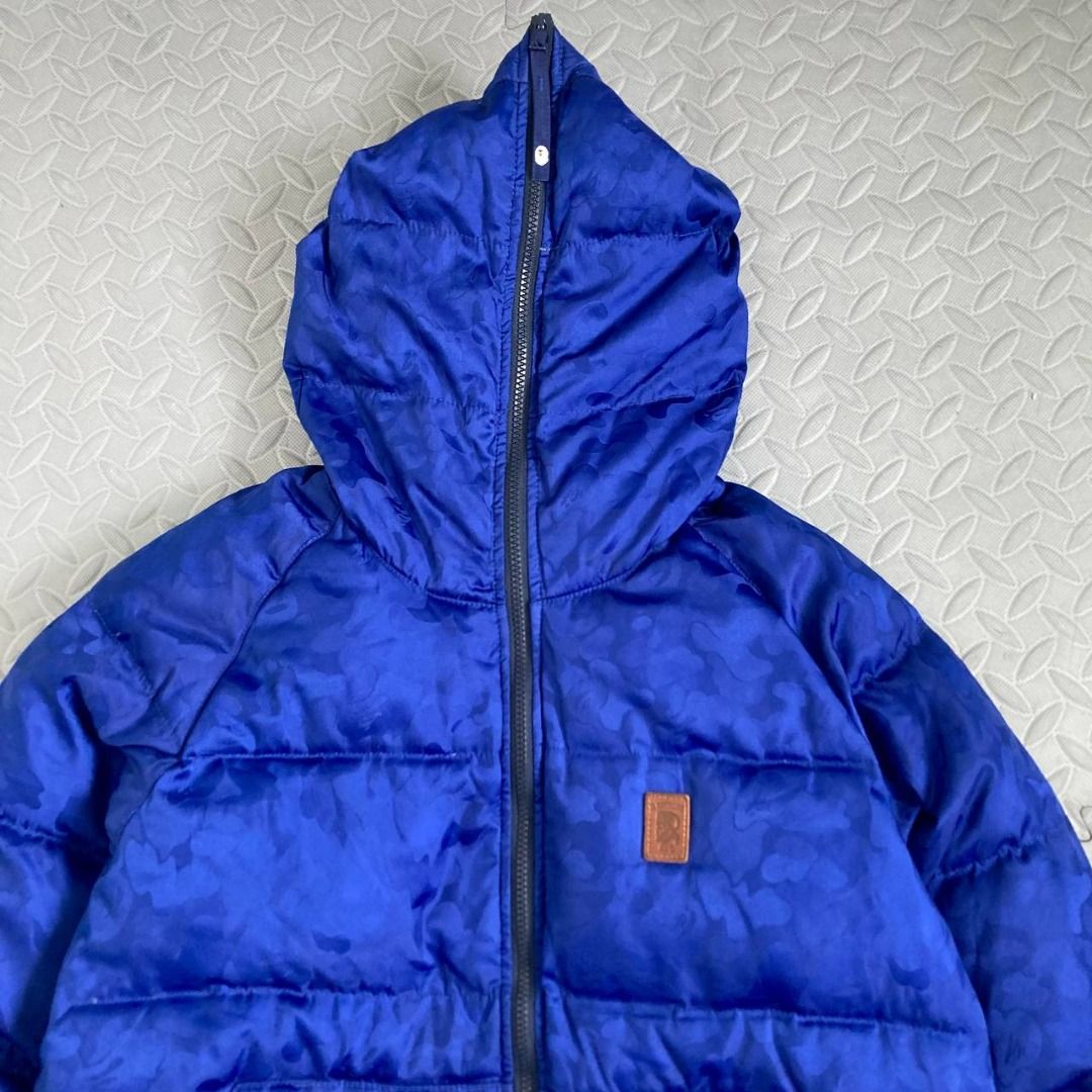 Bape -Hidden Camo Mountain Down Jacket (Category: Coats, Jackets and Outerwear) located in Quezon City. Submitted by archived.g (Listing ID 1460905977, Image 3). Description: Bape -Hidden Camo Mountain Down Jacket - Brand: Bape Made in: China Year: Material: Polyester, Nylon, Down Color: Blue Marked size: L Sizing: Measurements (laid flat): Shoulders: 18" Sleeves: 24” Width: 21.5” Hem: 19.5" Length: 26.5” Color rating: 9/10 Condition: 8.5/10 Flaw