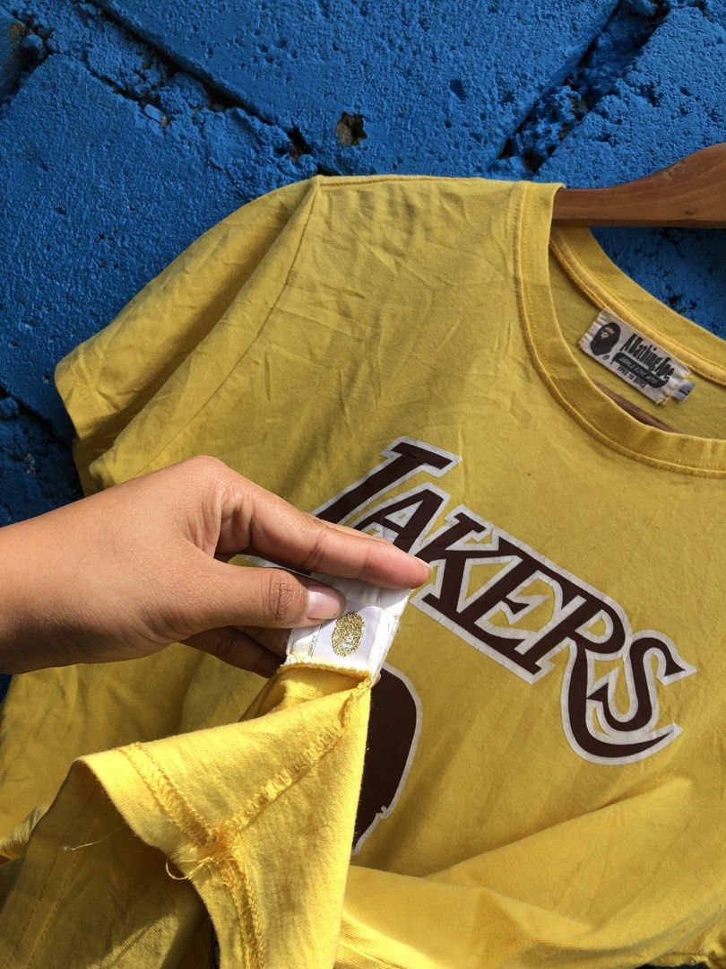 bape x lakers (Category: Tshirts & Polo Shirts ) located in Manila. Submitted by thriftyah_23 (Listing ID 1460776469, Image 3). Description: BAPE x Mitchell & Ness Lakers Tee 27’20.