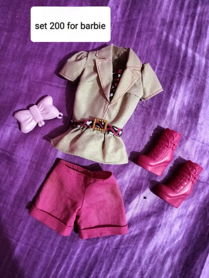 Barbie Doll Clothes Sets and Accessories (Category: Kids Toys) located in Cagayan de Oro. Submitted by jadedaaca296783 (Listing ID 1460789071, Image 3). Description: - Assorted Barbie doll clothes and accessory sets available. - Outfits include jackets, skirts, dresses, and shoes. - Comes with a small Barbie doll featuring pigtails. - Perfect for collectors and playtime. - Prices vary per set. - Message for specific item details..