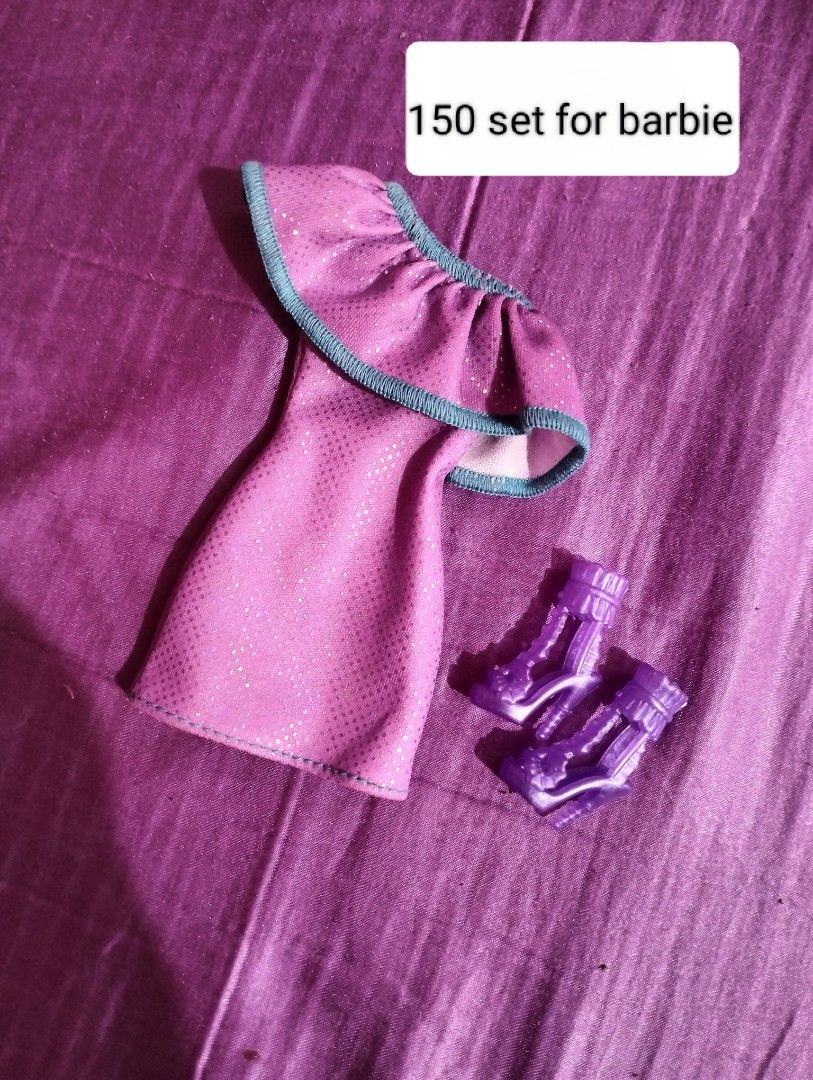 Barbie Doll Clothes Sets and Accessories (Category: Kids Toys) located in Cagayan de Oro. Submitted by jadedaaca296783 (Listing ID 1460789071, Image 2). Description: - Assorted Barbie doll clothes and accessory sets available. - Outfits include jackets, skirts, dresses, and shoes. - Comes with a small Barbie doll featuring pigtails. - Perfect for collectors and playtime. - Prices vary per set. - Message for specific item details..