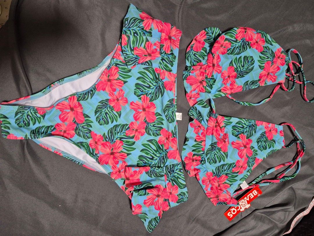 BEACOOS Tropical Floral Bikini Set (Category: Bikinis & Swimsuits) located in Santo Tomas. Submitted by bellaswann18 (Listing ID 1460815907, Image 1). Description: - Adorable tropical print bikini featuring hibiscus flowers and monstera leaves. - Halter neck bikini top with charming ruffled trim. - Matching high-waisted bikini bottoms. - Adjustable ties ensure a comfortable and secure fit. - Perfect for your next beach day or pool party!.