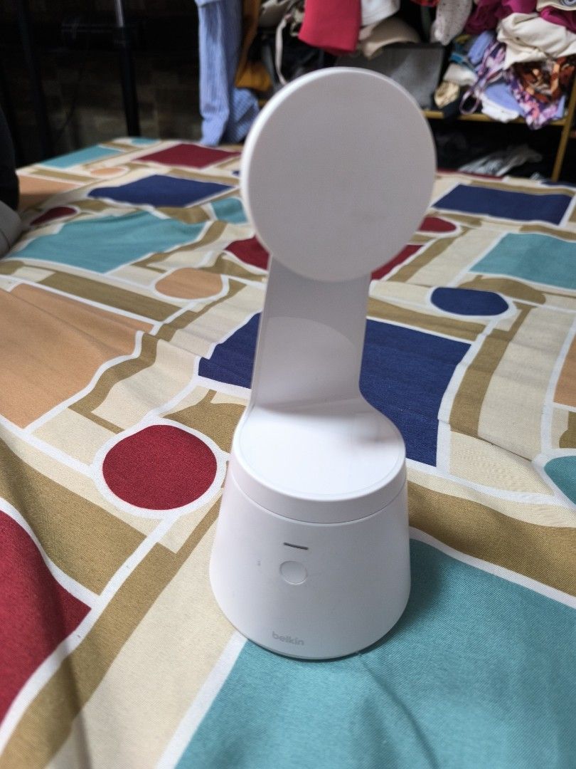 Belkin Wireless Charger Stand (Category: Chargers & Cables) located in Caloocan City. Submitted by chefems0721 (Listing ID 1460799465, Image 1). Description: - White Belkin wireless charger stand - Circular base with vertical arm - Charging pad for phones - Rubber feet for enhanced stability - Features QR code and App Store logo on the base.