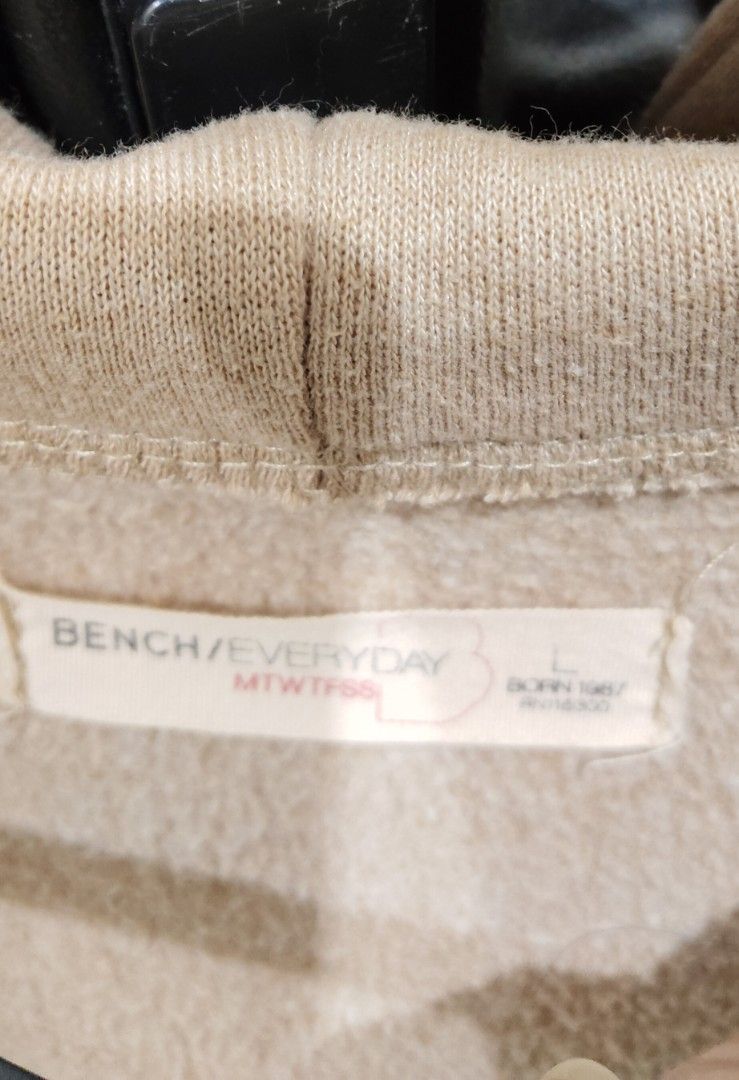 Bench Unisex Hoodie (Category: Coats, Jackets and Outerwear) located in Rizal. Submitted by reese511 (Listing ID 1460817549, Image 2). Description: - BENCH/EVERYDAY beige zip-up hoodie -Unisex - Size: Large (L) - Features soft interior lining - Two front pockets - Ideal for casual wear or layering - Easy to zip up and down.