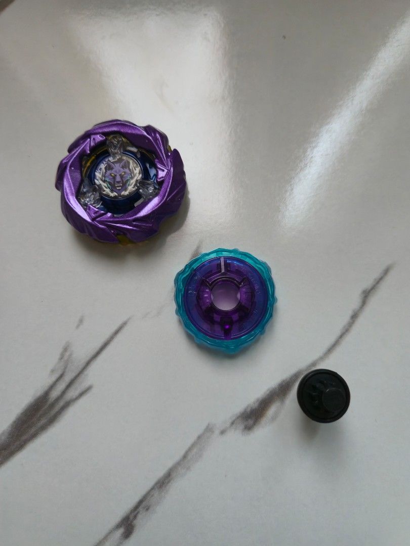 BEYBLADE X UX-21 SILVER WOLF PURPLE COATED (Category: Action & Battle Toys) located in Quezon City. Submitted by aisarang_u (Listing ID 1460778610, Image 2). Description: -UX-21 SILVER WOLF PURPLE COATED 9-70 RUSH (BLACK) -A5 A6 MOLD -UNSEALED, UNUSED -750 -location: Quezon City.