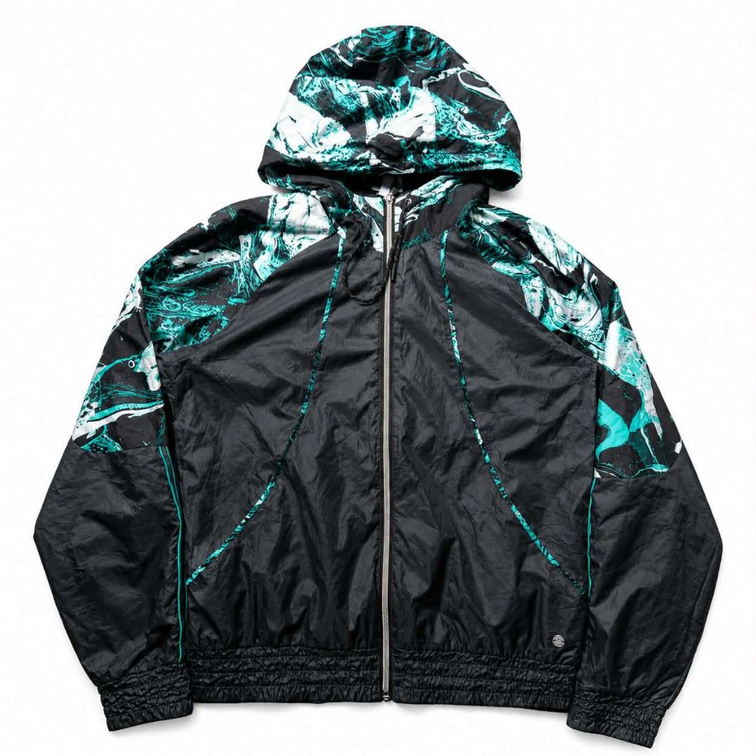 Black & Teal Abstract Print Hooded Windbreaker Jacket (Category: Coats, Jackets and Outerwear) located in Manila. Submitted by chieezz (Listing ID 1460863186, Image 1). Description: - Stylish black windbreaker jacket - Vibrant teal and white abstract print on hood and sleeves - Full zip front closure - Elasticated cuffs and hem for a snug fit - Lightweight material, perfect for windy weather or layering - Features a small logo detail on the lower