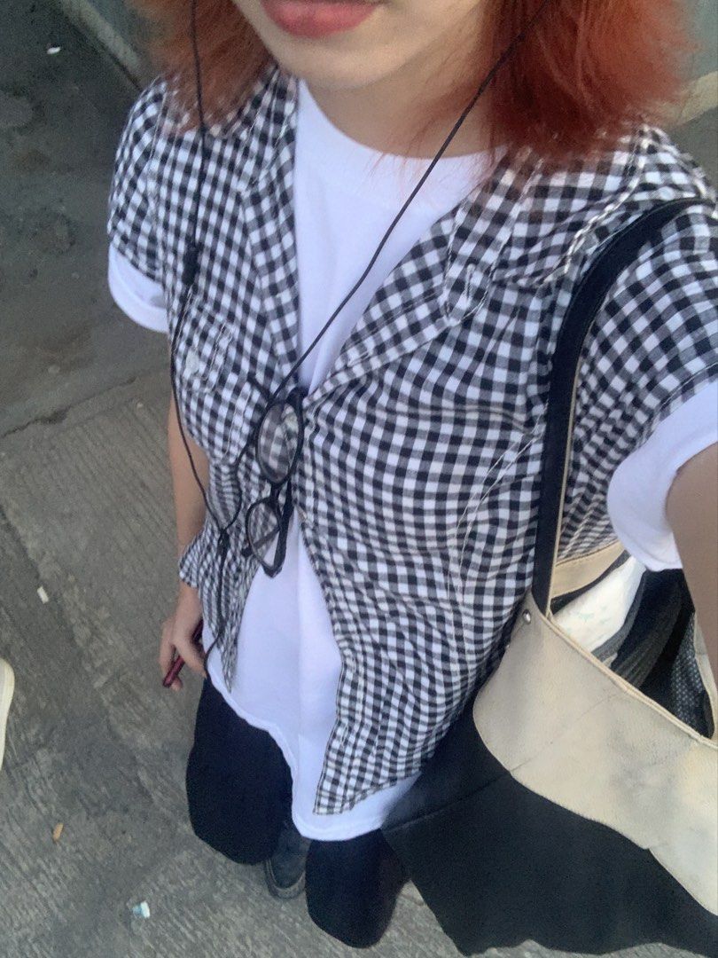 Black and White Gingham Button-Up Shirt (Category: Tshirts & Polo Shirts ) located in Manila. Submitted by sphiere (Listing ID 1460723906, Image 2). Description: - Classic black and white gingham pattern - Short sleeves - Collared neckline - Button-up front - Single chest pocket - Perfect for casual styling - Great for layering or wearing on its own.