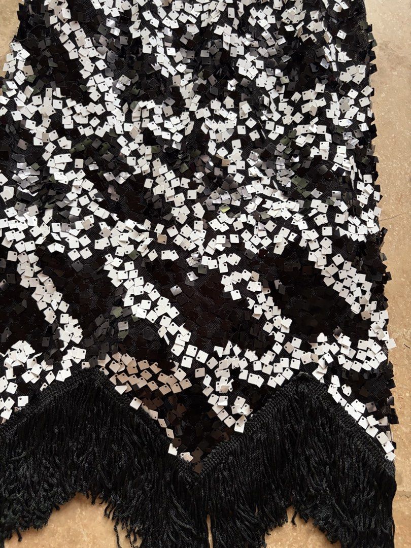 Black and White Sequin Fringe Flapper Dress (Category: Dresses) located in Quezon City. Submitted by tidyup.lara (Listing ID 1460919236, Image 2). Description: Best fits XS-S frames Bust 26” Waist 28” Length 31” Condition 9/10: good as new.