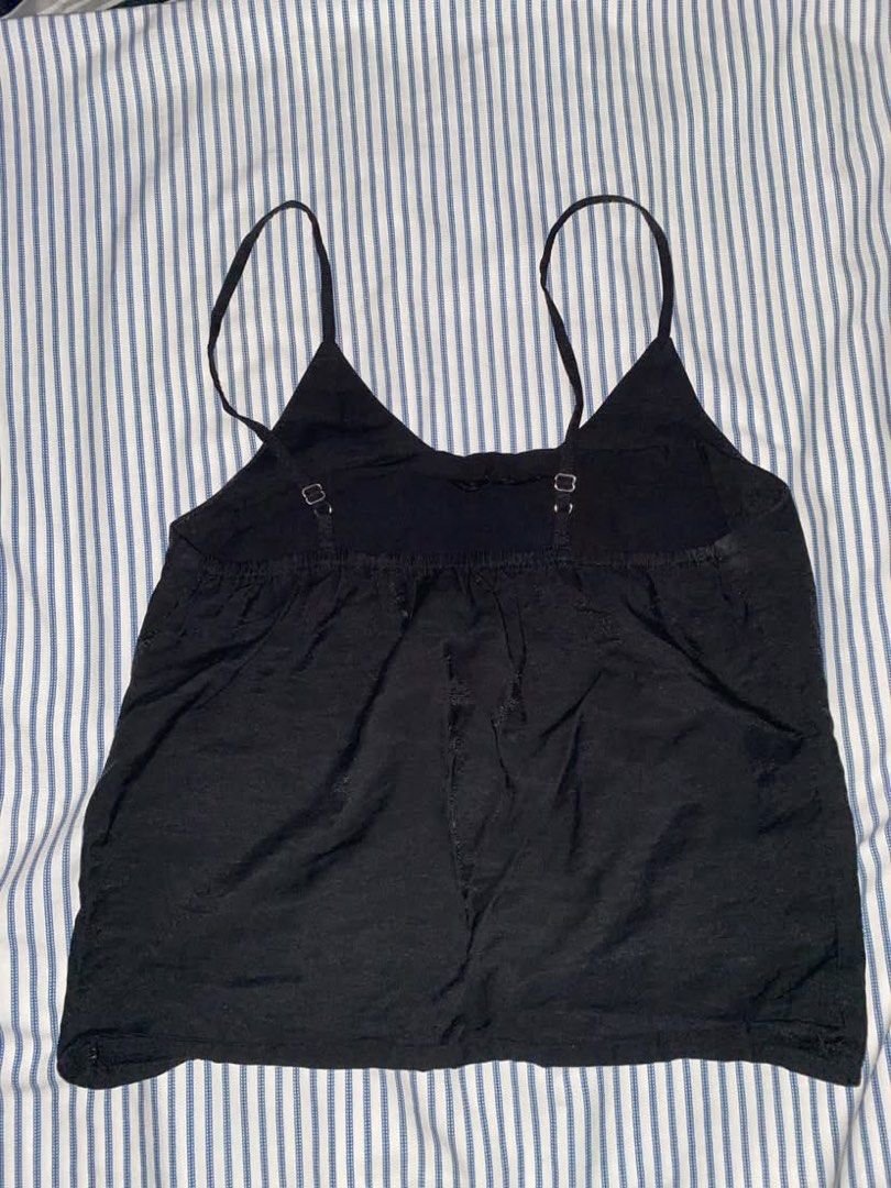 Black Cami Top with Adjustable Straps (Category: Sleeveless) located in Manila. Submitted by _dayanughhhh (Listing ID 1460874333, Image 2). Description: - Basic black cami top - Thin, adjustable straps - Fabric with a slight sheen - Smocked/elasticated back panel for a better fit - Versatile: great for layering or wearing on its own - Easy to pair with any outfit.