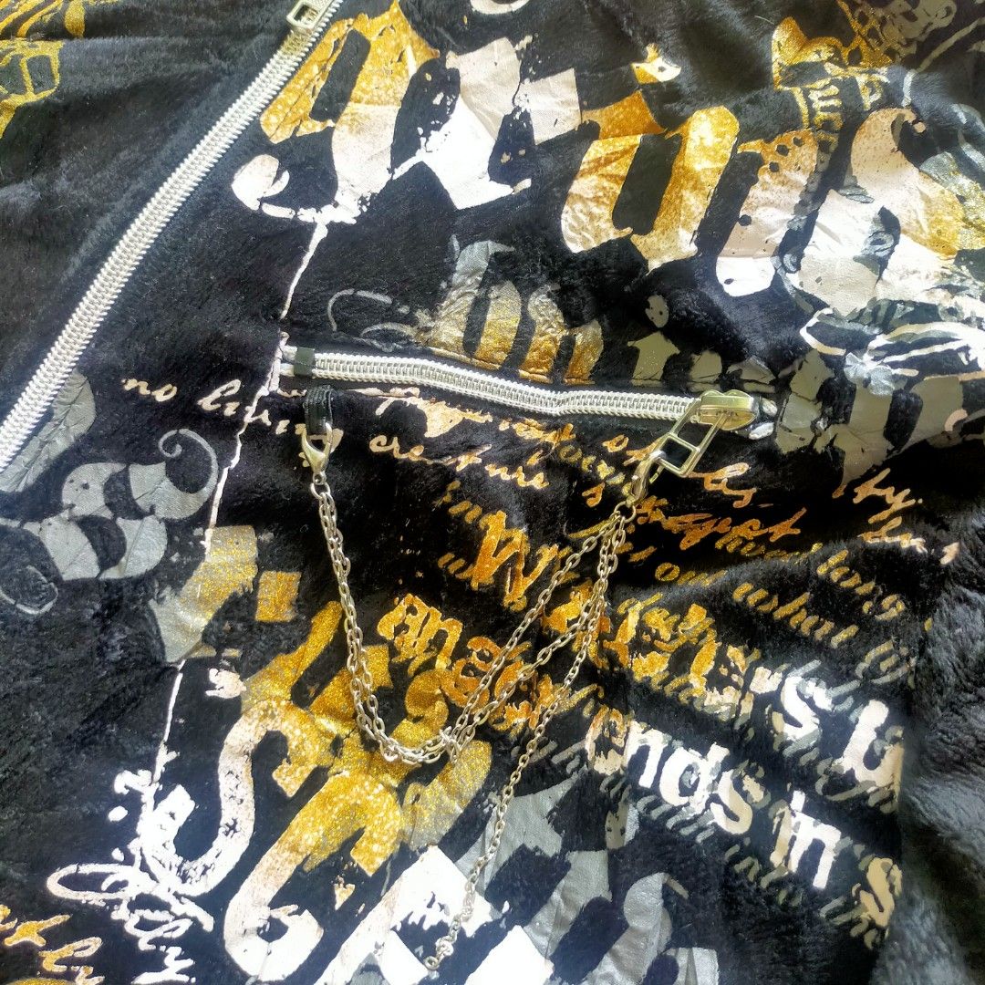 Black Graphic Print Zip-Up Hoodie (Category: Hoodies) located in Zamboanga. Submitted by _oliverbmth (Listing ID 1460890134, Image 3). Description: - Black zip-up hoodie - Size: Medium (M) - Bold graphic print (text & abstract designs) in yellow and white on front and back - Drawstring hood - Front pockets - Soft, comfortable material - Dimes 21x26 .