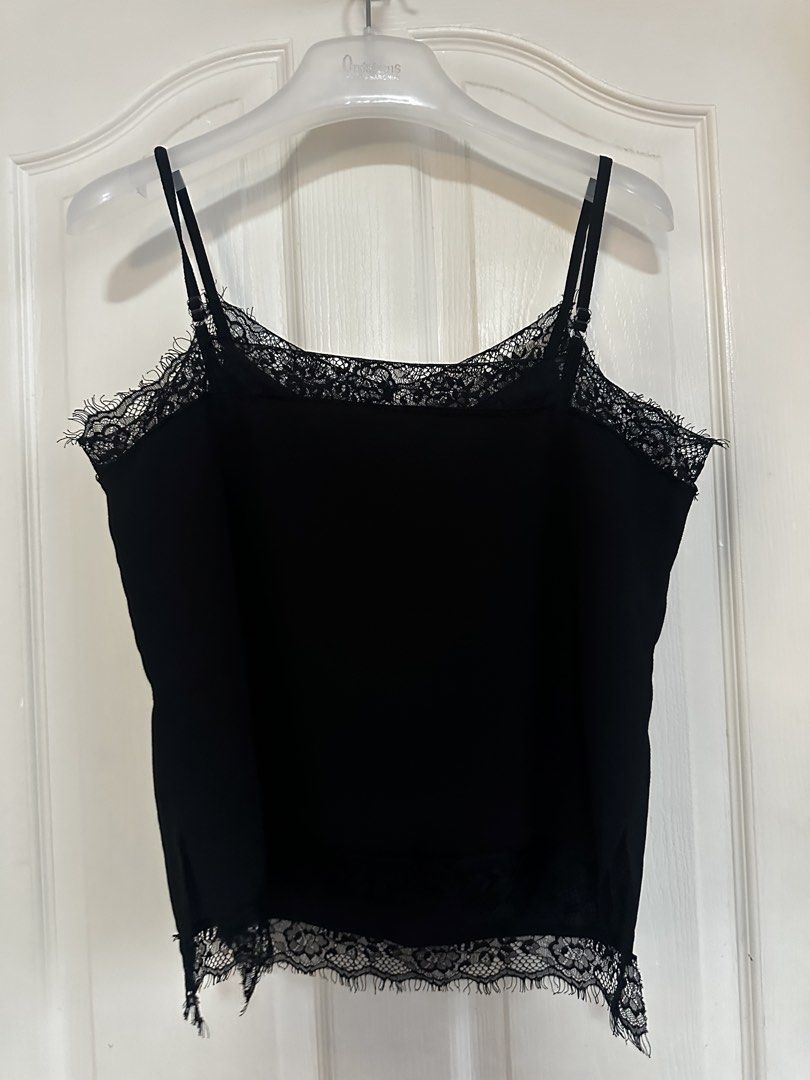 Black Lace Trim Cami Top Spaghetti Straps (Category: Sleeveless) located in Manila. Submitted by nfcloset_ (Listing ID 1460792456, Image 1). Description: - Elegant black cami top - Features delicate lace trim along neckline and hem - Adjustable spaghetti straps - Simple and chic design - Highly versatile: perfect for layering or wearing on its own - Suitable for dressing up or down.