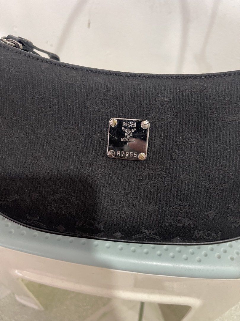 black MCM monogram pochette shoulder bag (Category: Luxury Bags & Wallets) located in Manila. Submitted by john_robert00 (Listing ID 1460893579, Image 2). Description: black MCM monogram pochette shoulder bag Issue : none Pm sa details .