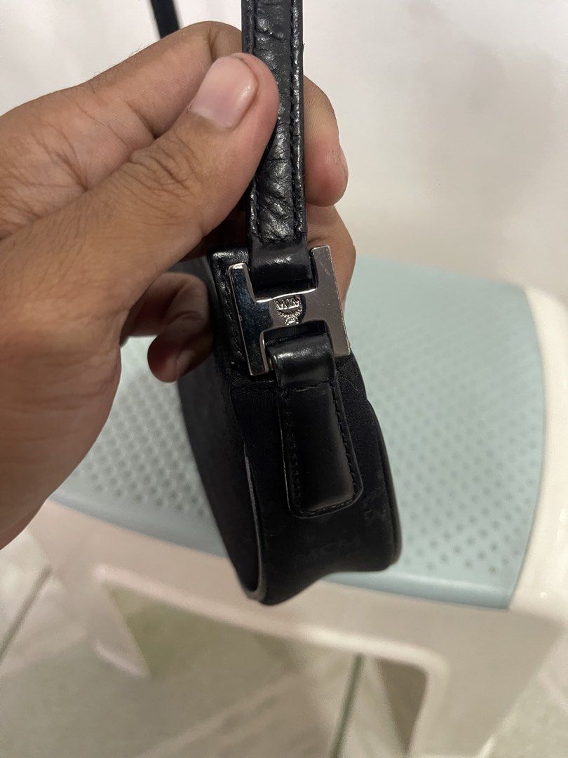 black MCM monogram pochette shoulder bag (Category: Luxury Bags & Wallets) located in Manila. Submitted by john_robert00 (Listing ID 1460893579, Image 3). Description: black MCM monogram pochette shoulder bag Issue : none Pm sa details .